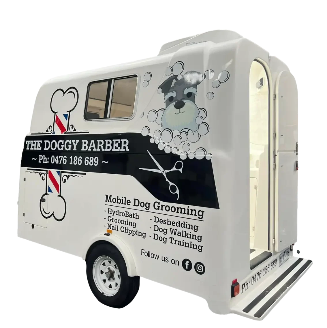 Side view of a mobile dog grooming van named "The Doggy Barber." The white van features a logo of a playful dog with bubbles, along with a list of services: HydroBath, Grooming, Nail Clipping, Deshedding, Dog Walking, and Dog Training. Contact info is provided.